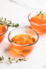 mandarin jelly. orange jelly in plate and slices of tangerine