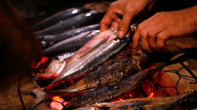 Selective focus of Grilling Cakalang fish or Skipjack tuna (Katsuwonus pelamis) on a cast iron grill. close up view