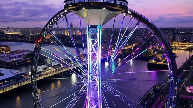 Dramatic Nighttime View of London Eye with Vibrant Lights