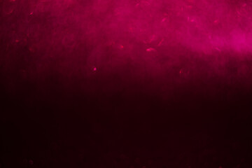 A pink background with a blurry pink object in the foreground