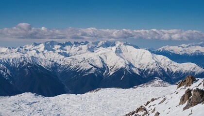 Obraz premium Majestic snowcapped mountains against a blue sky 17