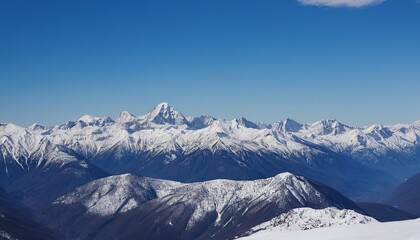 Obraz premium Majestic snowcapped mountains against a blue sky 8