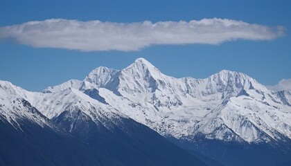 Fototapeta premium Majestic snowcapped mountains against a blue sky 5