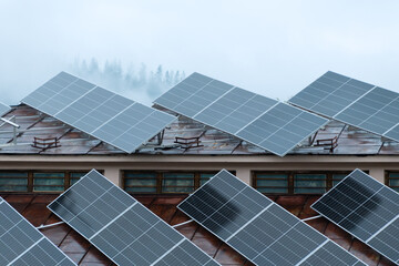 Obraz premium Solar panels on a building in bad weather.