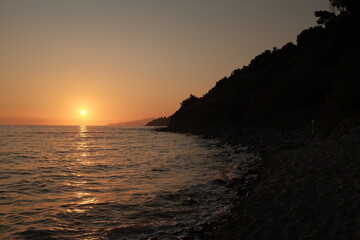 Serene Sunset at Sea: Tranquil Waters and Colorful Twilight Horizon