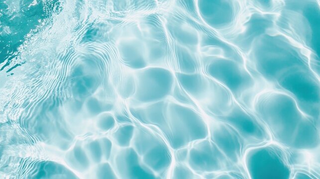 Abstract background of water ripples in swimming pool, light blue color