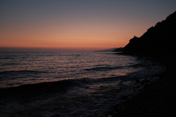 Vibrant Sunset Over Calm Sea: Idyllic Ocean View with Twilight Colors