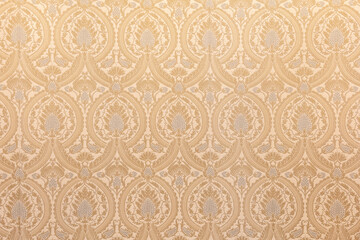 Fancy gold wallpaper background texture material structure full frame front view frontal shot backdrop, nobody. Luxorious wall ornamental floral patterns, antique retro vintage decorative design