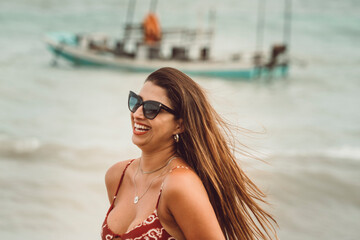 Beautiful brazilan bikini female model brunette smiling at the beach in Sao Miguel dos Milagres, Alagoas