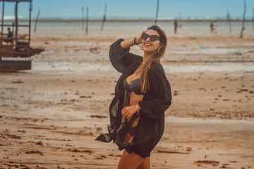 Beautiful brazilan bikini female model brunette smiling at the beach in Sao Miguel dos Milagres, Alagoas