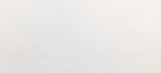 Simple bright white wide clean painted soft concrete wall background texture, minimal full frame wallpaper web banner, nobody, front view, well lit bright frontal shot. Office building plain wall