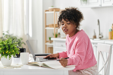 She enjoys a tranquil afternoon studying while cozy at home.