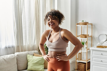 A cheerful woman promotes wellness and positivity in her cozy living space.