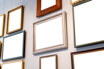 Different blank empty cut out frames paintings photos pictures on a gallery art museum wall, copy space template mockup, art exhibition concept, nobody, angle, generic. Works of art hanging on a wall