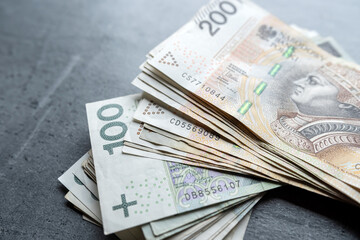 Financial background with many polish zloty banknotes 100 200 zl pln