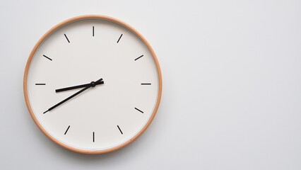 Minimalist wooden Wall Clock on White Wooden Surface with Space for Text – Time Set at 20.40, 08.40