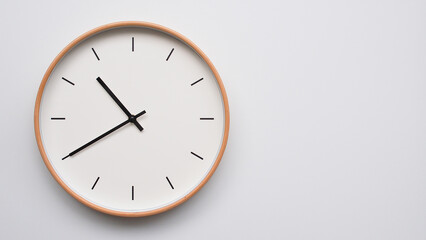 Minimalist wooden Wall Clock on White Wooden Surface with Space for Text – Time Set at 10.40,...