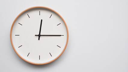 Minimalist wooden Wall Clock on White Wooden Surface with Space for Text – Time Set at 00.15/12.15