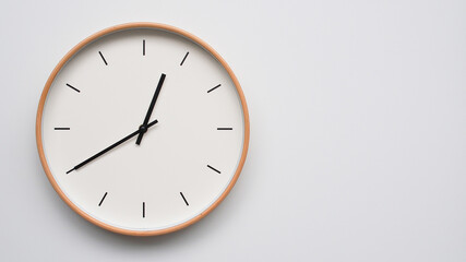 Minimalist wooden Wall Clock on White Wooden Surface with Space for Text – Time Set at 00.40/12.40