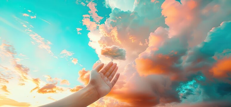 Hand reaching towards colorful sky with clouds. Hope, freedom, dreams, aspiration concept. Perfect for inspirational, motivational, and spiritual themes.