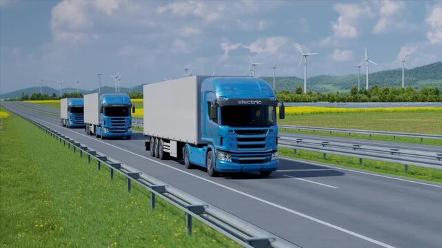 Convoy of autonomous electric semi trucks with cargo trailer driving along highway. Electrification and future fuels. Zero emission logistics and technology concept. 3d animation rendering