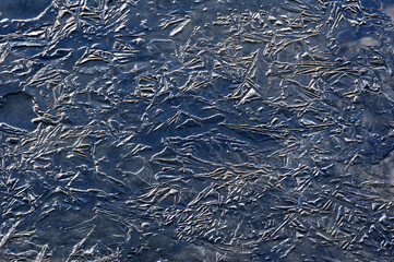 Effects of the cold in a frozen river in winter in Bormio, Valtellina