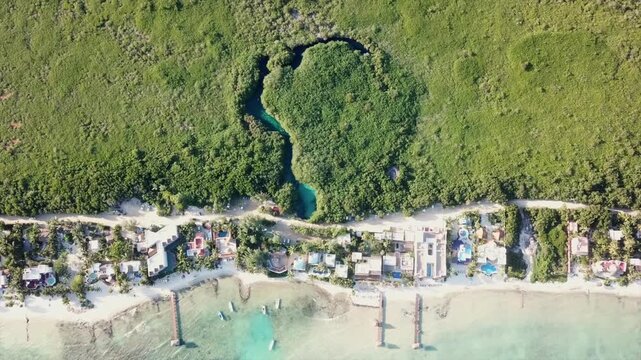 Topdown Aerial View of Casa Cenote (or Cenote Manati) in Tankah Bay, Tulum, Riviera Maya, Mexico.