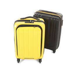 Two new yellow and black suitcases isolated on white