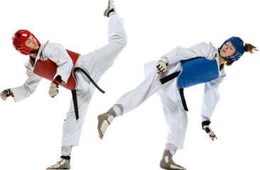 Dynamic portrait of two young women, taekwondo practitioners training together isolated on transparent background. Concept of sport, education, skills, combat sport, martial arts