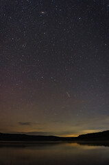 Fototapeta premium starry sky over the lake on a summer night
