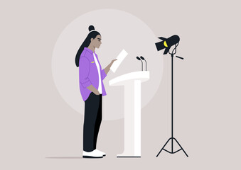 A confident individual reads from a paper while standing at a podium, focused under the spotlight and preparing to engage an audience