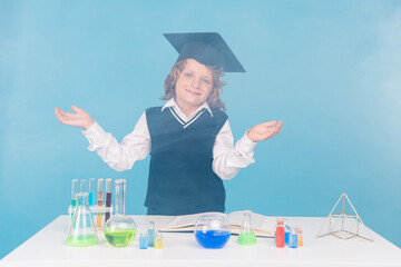 Photo of smart clever diligent intelligent boy chemical lab research isolated on blue color background