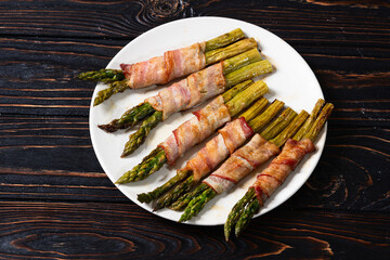 Fried asparagus rolled with bacon meat