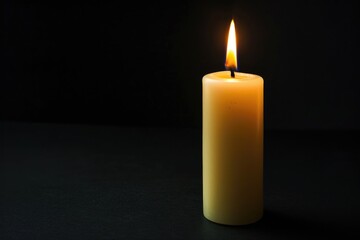 A lit candle on a table, symbolizing calmness, relaxation, and warmth. Used in meditation, romance, or as home decor.