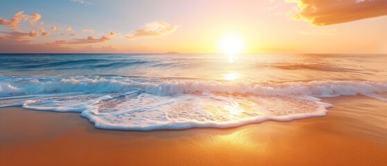  The sun sets over the ocean, waves approach the shore, foreground features a beach
