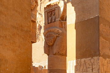 Gaze upon the divine visage of Queen Hatshepsut in the sacred sanctuary of her mortuary temple. Her...