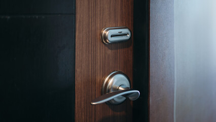 Electronic card key for open door in hotel. Smart card key to lock and unlock door. Security systems and protection concept.