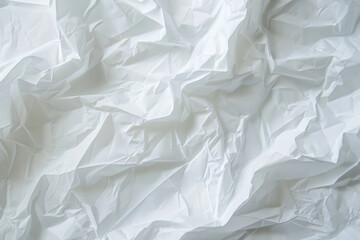 Obraz premium Crumpled white paper texture with soft shadows and highlights.
