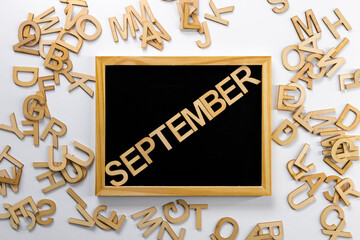 Wooden board with the name of the month 