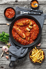 German Currywurst, pork sausages in a curry sauce