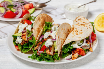 grilled chicken street tacos on a white plate