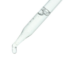 Dripping cosmetic serum from pipette isolated on white