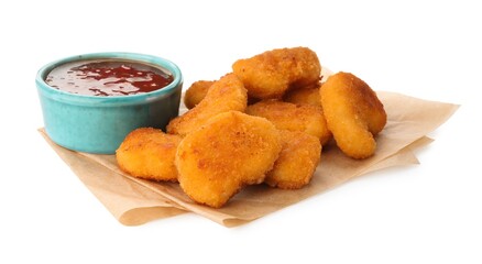 Hot chili sauce and pile of nuggets isolated on white