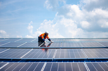 Engineer service check installation solar cell on the roof of factory , Sustainable energy industry concept, Renewable energy solution for climate change © golfloiloi