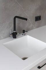 kitchen faucet on a stylish metal sink