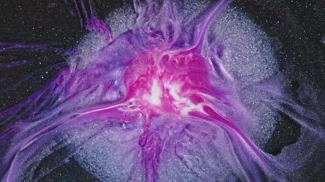 Top view of a purple fluid texture with shinny lilac swirls and veins, painted in the style fluid art acrylic. The macro video on a dark glitter background.