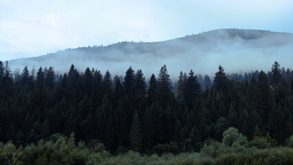 Mountain landscape with clouds and fog