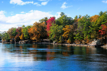 Beautiful landscape of the Thousand Islands along the Canada USA border during autumn with fall...