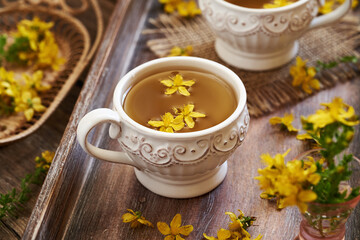 St. John's wort or Hypericum tea in a white cup
