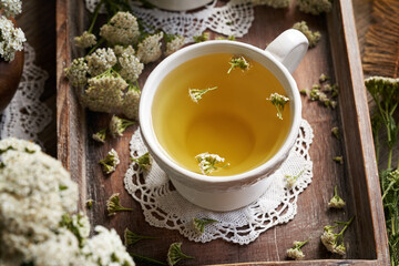 Yarrow tea in a white ceramic cup